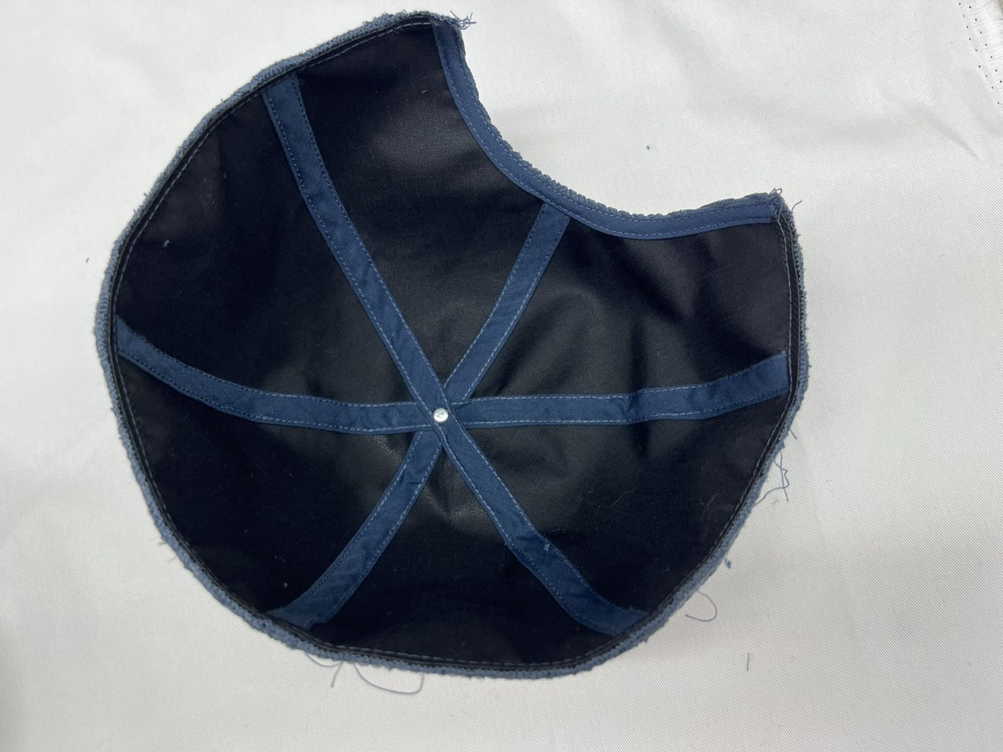 bottom of brimless hat during production